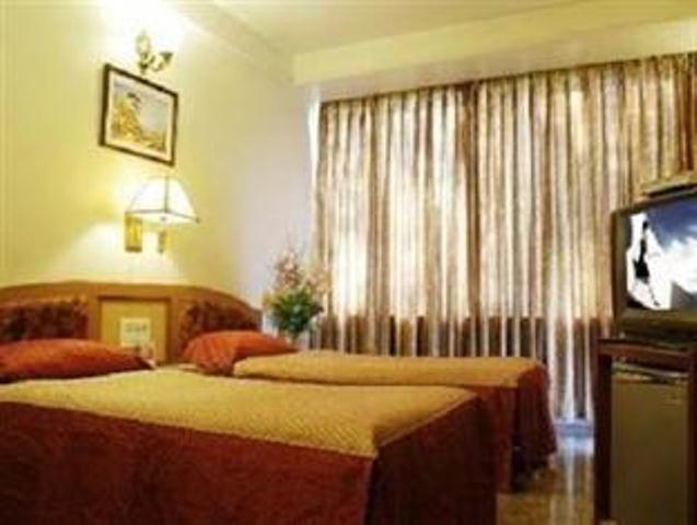 The Ambience Hotel Pune Quarto foto