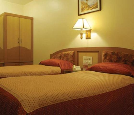 The Ambience Hotel Pune Quarto foto