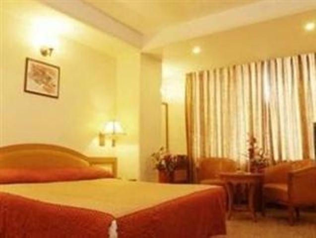 The Ambience Hotel Pune Quarto foto
