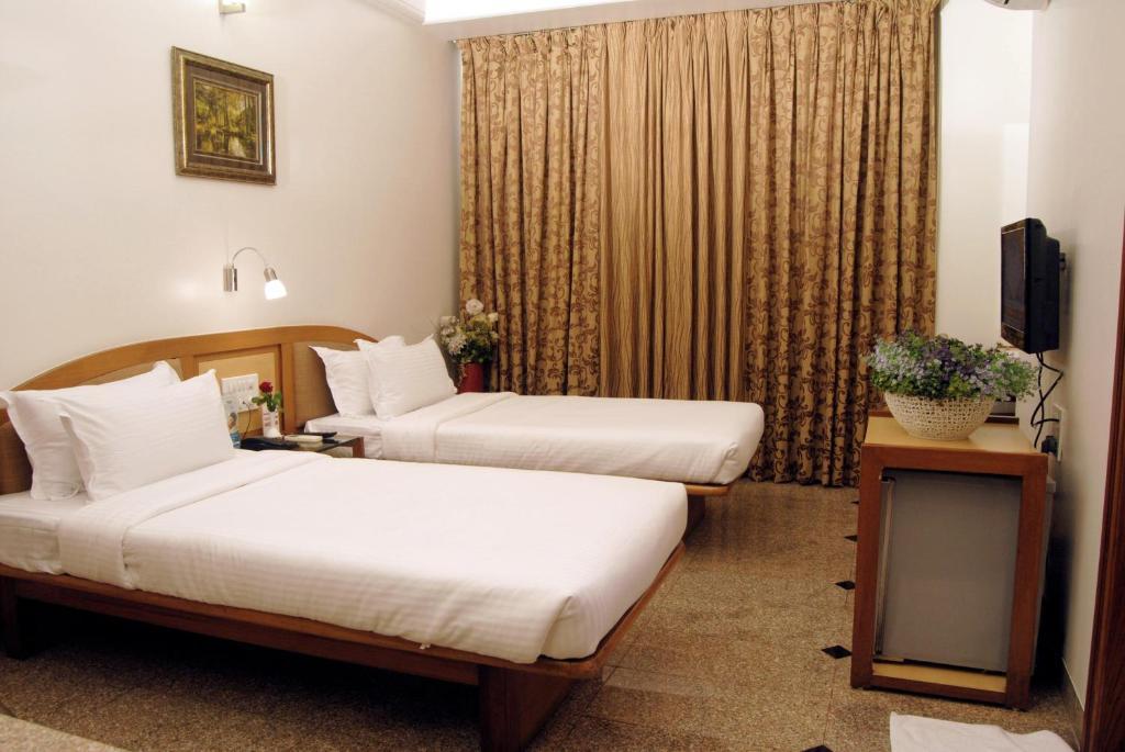 The Ambience Hotel Pune Quarto foto