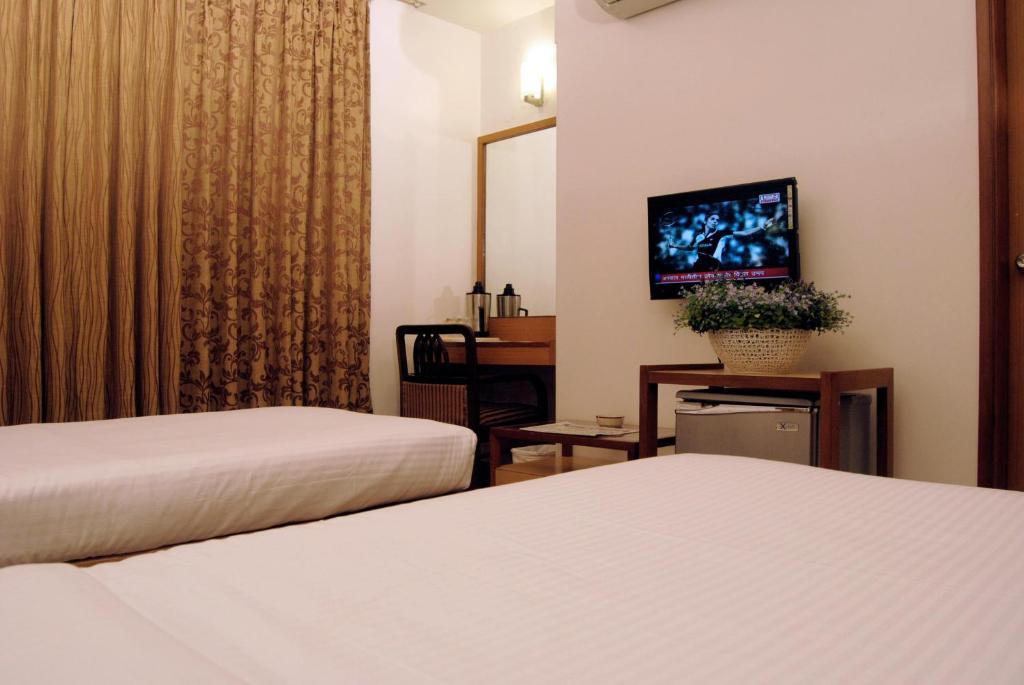 The Ambience Hotel Pune Quarto foto
